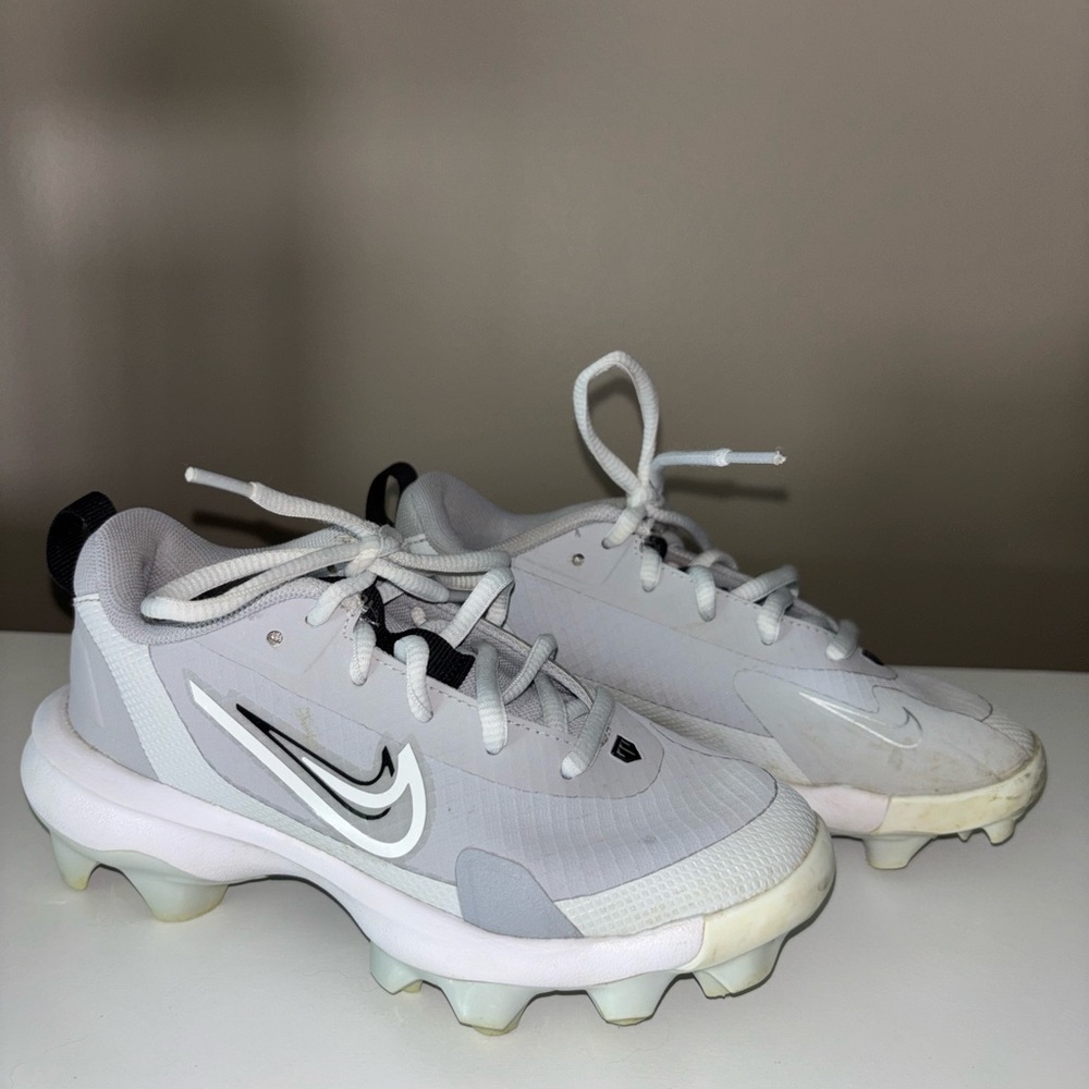 Nike Kids White and Black Cleats with Silver Swoosh